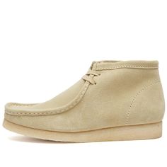 The iconic Clarks Originals Wallabee boot - spotted on insta feeds from NYC to London. With structural silhouette and signature crepe sole, this classic boot has endured decades of hip hop scenes, school days and now Gen Z. Crafted from rich suede leather with cushioned moccasin construction, its timeless look pairs easily from vintage fashion finds to athleisure fits. Durable enough for daily wear yet chic to flaunt, own this footwear legend that proves some styles are forever staples. Streetwear Moc Toe Boots With Rubber Sole, Casual Desert Boots With Round Toe For Streetwear, Casual Streetwear Desert Boots With Round Toe, Classic High-top Boots For Streetwear, Casual Plain Toe Boots For Streetwear, Vintage Moc Toe Boots With Stitched Sole, Classic Moc Toe Boots For Streetwear, Suede Boots With Rubber Sole For Streetwear, High-top Desert Boots With Suede Lining