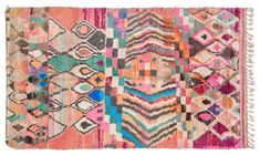 a multicolored rug with fringes and designs on the bottom, in different colors