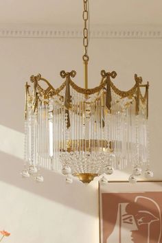 a chandelier hanging from the ceiling in a room