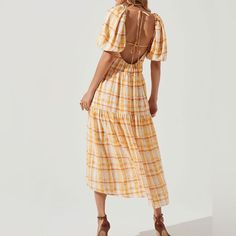 New In Medium (Would Fit Large) There’s Just Something About Summertime And Plaid. This Dress From Astr Has A Square Neckline, Puff Sleeves, And A Tiered Design. The Details- Short Puff Sleeves Open Back Features Tying Straps Fully Lined Side Pocket Accents Yellow Tie-back Dress For Vacation, Yellow Midi-length Dress With Smocked Back, Yellow Midi Dress With Smocked Back, Fitted Yellow Maxi Dress With Tie Back, Spring Yellow Midi Dress With Smocked Back, Casual Yellow Midi Dress With Smocked Back, Yellow Tie Back Dress For Vacation, Yellow Cotton Midi Vacation Dress, Casual Yellow Maxi Dress With Smocked Back