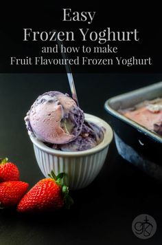 two bowls filled with ice cream next to strawberries