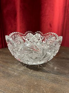 a glass bowl sitting on top of a wooden table