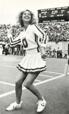 an old photo of a woman playing tennis