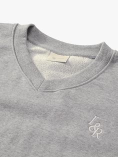 This product combines the timeless appeal of a V-neck sweatshirt with the unique flair of the Lossyrow logo, creating a piece that's both comfortable and stylish. It boasts a dropped shoulder design for a relaxed fit, making it a perfect layer for those cooler days. The ribbed V-neckline adds a classic touch, while the understated logo embroidery on the chest lends a refined edge. - A relaxed, slightly cropped cut ensures a modern, streetwear-inspired look.- The soft, brushed fabric provides a cozy feel without sacrificing style.- Subtle logo embroidery on the chest serves as a tasteful brand signature.- Thoughtful design details, like the ribbed V-neck and hem, elevate the overall aesthetic. V Neck Sweatshirt, Modern Streetwear, Shoulder Design, Logo Embroidery, Grey Sweatshirt, Embroidery Logo, Design Details, Overalls, Relaxed Fit