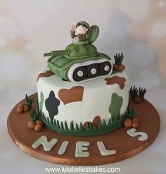 a birthday cake decorated with a tank on top