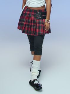 a young girl in a red and black plaid skirt Punk Style Pleated Skirt For School, Punk Pleated Skirt For School, Casual Mini Skirt For Alternative Fashion, Casual High Waist Skirt For Alternative Fashion, Casual Fall Skirt For Alternative Fashion, Red Casual Bottoms For Alternative Fashion, Casual Red Bottoms For Alternative Fashion, Punk Style Cotton Skirt For Fall, Casual Stretch Skirt For Alternative Fashion