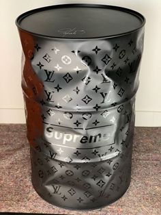 a black and white bucket sitting on top of a counter