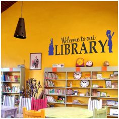 there is a library with yellow walls and bookshelves