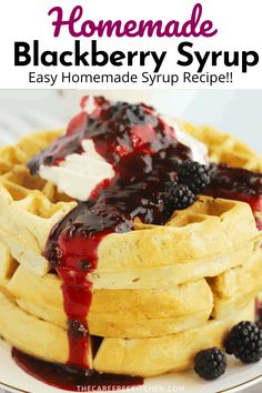 homemade blackberry syrup on top of waffles with berries