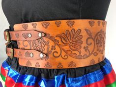 Winter Fire is a beautiful floral design created by Metis artist Victoria Scattergood. Our traditional hand-stamped leather belts are handcrafted with the utmost attention to detail and quality: Made from 9-10 oz vegetable-tanned leather (extremely thick) 4 inches wide Belts are adjustable up to 4 inches Intricate floral and geometric pattern stamping designs created by our Indigenous design team Hand dyed in-house in a range of natural finishes Require regular oiling to maintain durability and Native Leather Crafts, Navajo Sash Belt Designs, Thick Leather Belt, Native American Belt, Adjustable Leather Belt Buckles, Traditional Style, Traditional Leather Belt Buckle, Adjustable, Adjustable Leather Belt Buckles In Traditional Style, Adjustable Traditional Leather Belt Buckles, Traditional Adjustable Leather Belt