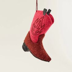 Shop adorable and unique fairly traded ornaments at Craftspring. Hand felted with love by women artisans in Kyrgyzstan, from soft natural wool, our red on fire cowboy boot ornament is the perfect gift for all the cowboys in your life. Check out our website for the best holiday decorations! Heirloom Ornaments, Felt Boots, Felt Christmas Ornaments, Crafts Beautiful, Hand Felted, Cowboy Boot, Felt Christmas, Women Artisans, Beautiful Gifts