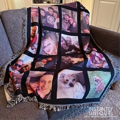 a blanket that has pictures of people and dogs on it, sitting on a couch