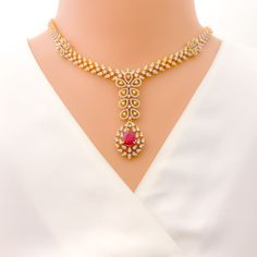 This exquisite 18k gold set, weighing 62.8 grams, features a stunning floral design adorned with dazzling diamonds and rubies. The yellow gold finish enhances its luxurious appeal, making it perfect for any special occasion. The set includes a necklace with a total diamond weight of 8.34 carats, featuring F-G color and VS quality diamonds in round shapes. The rubies are elegantly shaped in pears and are interchangeable, adding versatility to the design. The necklace has a length of 16.75 inches Luxury Ruby Necklace With Brilliant Cut, Luxury Ruby Diamond Necklace With Diamond Accents, Luxury Ruby Diamond Necklace With Accents, Luxury Ruby Necklaces With Diamond Accents, Luxury Ruby Necklace With Diamond Accents, Elegant Ruby Jewelry Sets For Reception, Exquisite Yellow Gold Bridal Necklace For Formal Occasions, Luxury Ruby Round Bridal Necklace, Formal Ruby Diamond Necklace With Brilliant Cut