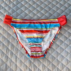 New Boutique Style Bikini Bottoms Size Medium Multi Colored With Runched Sides Please Ask Any Questions Thank You For Stopping By My Closet! Bundle And Save For A Great Price! Red Casual Tankini For Swimming, Casual Red Tankini For Pool, Casual Red Tankini For Swimming, Red Stretch Tankini For Spring, Red Spring Bottoms For Beach Party, Red Bottoms For Spring Beach Party, Spring Red Bottoms For Beach Party, Spring Pool Red Bottoms, Vibrant Red Beach Bottoms