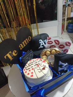 a box filled with lots of different types of cakes and chocolates on top of a table