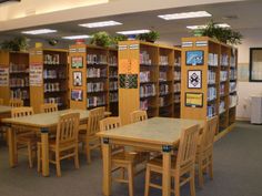 the tables and chairs are empty in the library