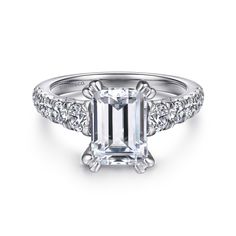 an emerald cut engagement ring with diamond accents