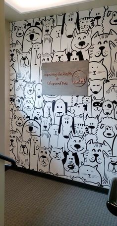 a wall with many dogs drawn on it