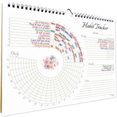 a spiral - bound calendar with flowers on it