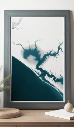 an abstract painting is displayed in a frame