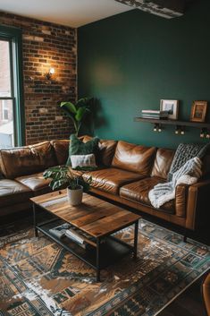 a living room filled with furniture and a large window next to a brick wall in front of it