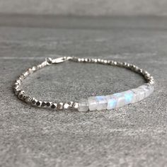 Rainbow Moonstone Bracelet | Natural Crystal Jewelry | Hill Tribe Silver Tiny Bead Bracelet | Dainty Genuine Moonstone Jewelry by GemsByKelley on Etsy https://www.etsy.com/listing/596364500/rainbow-moonstone-bracelet-natural Silver Minimalist Beaded Bracelets With Natural Stones, Minimalist Handmade Moonstone Bracelets, Handmade Minimalist Moonstone Bracelets, Minimalist Handmade Moonstone Beaded Bracelets, Minimalist Handmade Beaded Bracelet With Moonstone, Minimalist Handmade Moonstone Beaded Bracelet, Handmade Minimalist Moonstone Beaded Bracelet, Minimalist Moonstone Bracelets With Round Beads, Minimalist Moonstone Bracelet With Round Beads