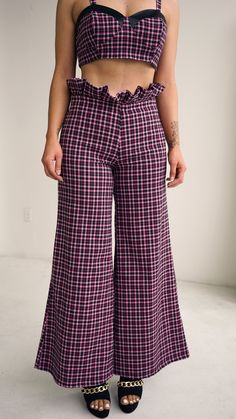 These pants are a must have for that 90’s girl chic look. This look is for the girl who is not afraid to say “I’m sexy, and professional.” Pair this look with our crop plaid bra & our crop wool jacket with pink sparkle buttons for an elevated look you must have in your closet! Perfect for a day at the office and for cocktails later in the day, this look is so very versatile. Pants have a 29" inseam with a back invisible zipper. Fabric has some stretch in it for a snug fit. Model is 5' 7" tall we Royalty Clothing, Must Have In Your Closet, Vinyl Raincoat, 90s Girl, S Girl, Plaid Trousers, Versatile Pants, Pink Friday, Plaid Outfits