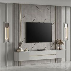 an entertainment center with a flat screen tv mounted on it's side, surrounded by silver and gold striped walls