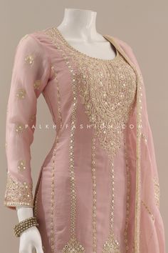 Ravishing attire to enhance your beauty. Be an angel and create and establish a smashing influence on anyone by wearing this light pink gharara outfit from palkhi fashion. Soft silk Top and palazzo pants highlighted with appealing embroidery, stones, resham, sequin weaving work, and handwork. Work enriched with enchanting & neat quality. A soft silk embroidery work dupatta accompanies this suit. Pink Mirror Work Palazzo Set For Eid, Pink Chinon Palazzo Set With Gota Work, Pink Palazzo Set With Mirror Work For Reception, Pink Palazzo Set With Mirror Work For Eid, Unstitched Pink Palazzo Set With Mirror Work, Designer Semi-stitched Pink Sharara, Pink Floor-length Sharara With Gota Work, Pink Embroidered Chinon Palazzo Set, Pink Chinon Palazzo Set For Wedding