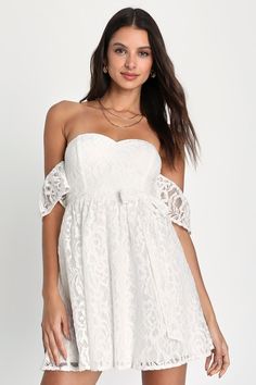 Pour some prosecco and grab your girlfriends, because the Lulus Inspired Cutie White Lace Off-the-Shoulder Mini Dress is ready for a day full of fun! Romantic floral lace (atop a matching knit liner) shapes this adorable dress that features a princess-seamed bodice with supportive boning throughout and a sweetheart neckline (with hidden no-slip strips), framed by fluttery off-the-shoulder sleeves. The high, fitted waist features a matching tying sash, that tops a twirly skater-style skirt that f White Semi Formal Dress, Semi Formal Dress, Country Dresses, Lulu Fashion, Indie Outfits, Mod Dress, Dress 100, Retro Dress, Retro Outfits