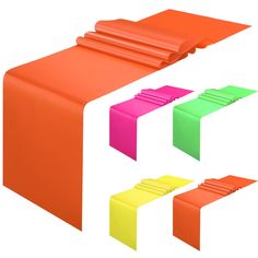 an orange table with four different colors on the top and one is pink, green, yellow, and red