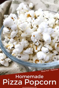 homemade pizza popcorn in a glass bowl on a tablecloth with the title overlay