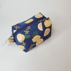 Whether you're storing your crafty notions, makeup or anything in between, this boxy pouch is the perfect companion for on-the-go essentials. The sturdy canvas outer fabric will hold up to daily use, while the soft cotton lining provides a fun contrast on the inside. This is a tried and true favourite of mine that I think you'll love as well! This pouch was handmade with care in Toronto, ON with thoughtfully sourced materials. Listing for pouch only - additional items shown for reference.  Dimensions:  Length - 16cm Width - 10cm Height - 7cm Functional Rectangular Zipper Pouch For Cosmetics, Practical Rectangular Cosmetic Bag For Storage, Practical Rectangular Cosmetic Storage Bag, Practical Rectangular Cosmetic Bag With Removable Pouch, Functional Cosmetic Bag With Zipper Pouch As Gift, Rectangular Cosmetic Bag With Zipper Pocket, Rectangular Cosmetic Bag With Zipper Pocket For Storage, Functional Cosmetic Bag With Zipper For Gift, Rectangular Zipper Pouch For Everyday Cosmetic Storage