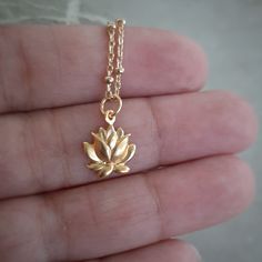 Beautiful 24 Karat gold over sterling silver blooming lotus charm. In Buddhism, a lotus flower signifies the soul rising up from the mud of ego and materialism, through the waters of practice and experience, and up into the sunshine of enlightenment. Measurement includes the ring: (mm) 16 x 10 x 2 The 5mm ring has a 4mm inside measurement so you will need a chain with a narrow end. This is a gem quality gold plate with 40 micro inches of 98.5% pure gold plated over sterling silver that will not Peace Necklace, Blooming Lotus, Lotus Necklace, Light Jewelry, Gold Lotus, Pure Gold, Lotus Flower, Buddhism, Jewelry Care