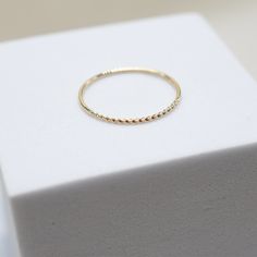 our Tiny Dancer Ring is as much of a classic as the beloved song it is named after. an ideal choice for minimalists or active lifestyles, you can't go wrong with this effortless band. ideal for stacking and a staple in curating your capsule jewelry collection. fine 14k solid gold .49 grams .9mm thick Adjustable Yellow Gold Rings For Everyday Use, Everyday Stackable White Gold Bands, Adjustable Everyday Rings With Round Band, Minimalist Adjustable Stackable Rings With Round Band, Everyday Stackable Rings With A Simple Design, Adjustable Round Band Rings For Everyday Wear, Adjustable Simple Design Stackable Rings For Everyday, Everyday Adjustable Round Band Rings, Adjustable Simple Stackable Rings For Everyday