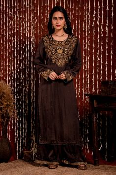 Brown kurta with floral, sequin, dabka, dori embroidered yoke. Paired with pant and dupatta.
Component: 3
Pattern: Embroidery
Type Of Work: Floral, sequin, dabka, dori
Neckline: Round
Sleeve Type: Full sleeves
Fabric: Kurta and Pant: Modal Satin, Dupatta: Silk Organza
Color: Brown
Other Details: 
Sheer dupatta
Embroidery on pant hem
Occasion: Sangeet - Aza Fashions Raw Silk Dupatta With Dabka For Reception, Semi-stitched Raw Silk Kurta With Dabka Work, Raw Silk Sets With Dabka For Reception, Raw Silk Salwar Kameez With Dabka For Reception, Chinon Kurta With Dabka For Reception, Reception Kurta In Raw Silk With Dabka Detailing, Unstitched Resham Embroidery Kurta For Reception, Unstitched Resham Embroidered Kurta, Designer Dabka Work Kurta In Chinon