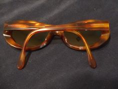 Vintage Giorgio Armani Made in Italy shades in tortoise shell with black accents. The lenses are a prescription for nearsighted. These have been used but are are in excellent condition. The hinges are still nice and tight. There are a few tiny scratches/scuffs on the lenses. These are very wearable and a classic. Please see the pics. These do not come with a case. If you need more photos let me know. Sent priority mail. For more more sunglasses, bags and accessories in my store click: https://ww Retro Brown Sunglasses For Formal Occasion, Brown Retro Sunglasses For Formal Occasions, Retro Brown Formal Sunglasses, Brown Retro Formal Sunglasses, Elegant Brown Oval Sunglasses, Vintage Oval Sunglasses For Formal Occasions, Vintage Brown Sunglasses For Formal Occasions, Brown Cat Eye Sunglasses For Formal Occasions, Retro Shades