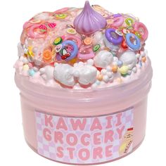 a pink plastic container filled with lots of candy