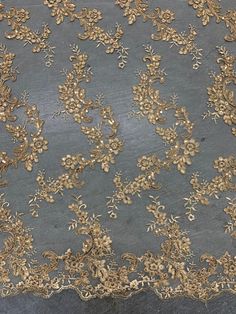 Cristina GOLD Polyester Floral Embroidery with Sequins on Mesh Lace Fabric - 10076 Stand out magnificently as you gracefully appear wearing this stunning lace fabric. Intricate embroidery adorns this fabric, with some sequins scattered all throughout, giving it a lavish and regal feel. Content: 100% polyester Stretch: Minimal to none Width: 50 to 52 inches Edge: Scalloped on both edges Uses: Wedding dress, evening gown, formal wear, tops, skirts, costumes, crafts, etc. Embroidery With Sequins, Wedding Dress Evening, Flowing Fabric, Golden Flower, Intricate Embroidery, Flower Accessories, Wedding Bridesmaid, Gown Wedding, Dress Evening