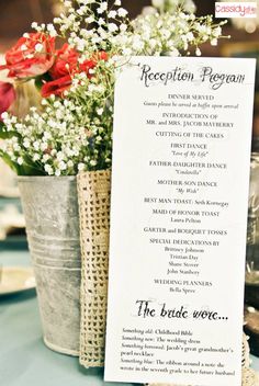 the reception program is displayed in an old tin can with flowers and lace on it