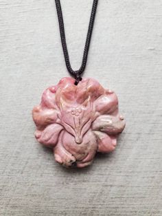 "Natural carved Rhodonite fox necklace, pink 9 tailed fox pendant, rhodonite necklace, gemstone carving animal necklace, Christmas gift for her You will receive the exact one as pictures and video as you choose from different fox necklaces! It is natural pink rhodonite with natural inclusions/other minerals that results in impurities we see in the rhodonite (impurities colors include black, dark green, clear, cream, gold etc.). There's no major flaws like big cracks on these Rhodonite carvings a Rhodonite Necklace, 9 Tailed Fox, Psychic Healing, Fox Necklace, Pink Rhodonite, Foxes Necklace, Gemstone Carving, Fox Pendant, Animal Necklace