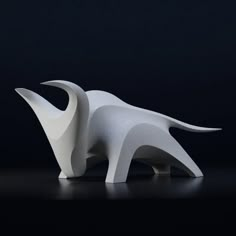 a white sculpture sitting on top of a table