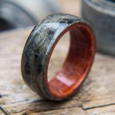 a wooden ring sitting on top of a wooden table