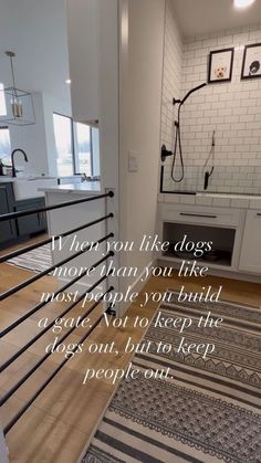 a bathroom with a rug on the floor and a quote written in white above it