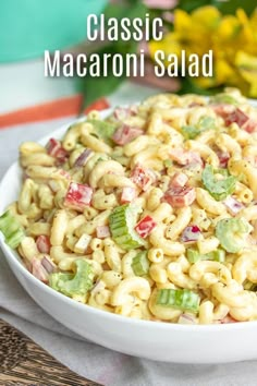 a bowl filled with macaroni salad on top of a table