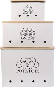 three white boxes with black lettering on the front and bottom, each containing garlics