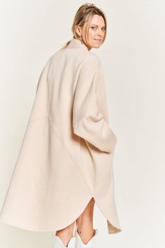 Indulge in ultimate comfort with our Oversized Knit Cardigan. Crafted from a plush, brushed knit material, this cardigan boasts a round-hemline and a front pocket for added convenience. Perfect for layering or simply relaxing, once you put it on, you won't want to part with this cardigan. (Trust us, it's that cozy!) Cozy Neutral Long-sleeve Outerwear, Cozy Long Sleeve Neutral Outerwear, Cozy Neutral Long Sleeve Outerwear, Relaxed Fit Soft Knit Outerwear For Work, Soft Knit Relaxed Outerwear For Work, Beige Soft Textured Outerwear For Spring, Beige Soft-textured Outerwear For Spring, Soft Textured Outerwear For Fall, Beige Soft Texture Outerwear For Spring