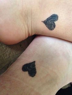 two people with matching tattoos on their legs