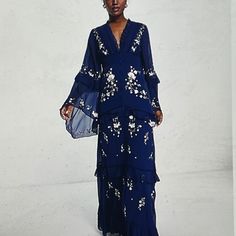 New W/O Price Tag Is An Overstock Outlet (Has Black Line Going Thru Cloth Label Name To Prevent Store Return) Authentic Asos Designs Dress - Tiered Embroidered Maxi Dress - Asos Design Tiered Floral Embroidered Maxi Dress With Raw Edge And Button Detail In Navy - Back Zipper Closure - Upper Tie Closure - Button Down On Front For Show Only; Does Not Work - Blue With Green,White And Pink Embroidered Floral Design - Size Us 6, Uk10; Measures Approx. 17" Flat From Pit To Pit, 29" Waist - Model Bust Bohemian Evening Dress In Georgette, Bohemian Georgette Evening Dress, Blue Georgette Dresses With Ruffles, Blue Floral Embroidered Maxi Dress For Evening, Spring Georgette Maxi Dress With Long Sleeves, Blue Georgette Dresses With Floral Embroidery, Blue Embroidered Maxi Dress For Parties, Blue Long Sleeve Georgette Dress, Spring Bohemian Embroidered Evening Dress