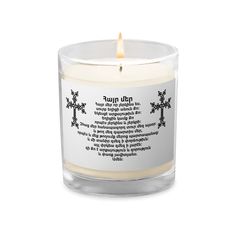 a candle that is sitting in front of a white background with the words on it